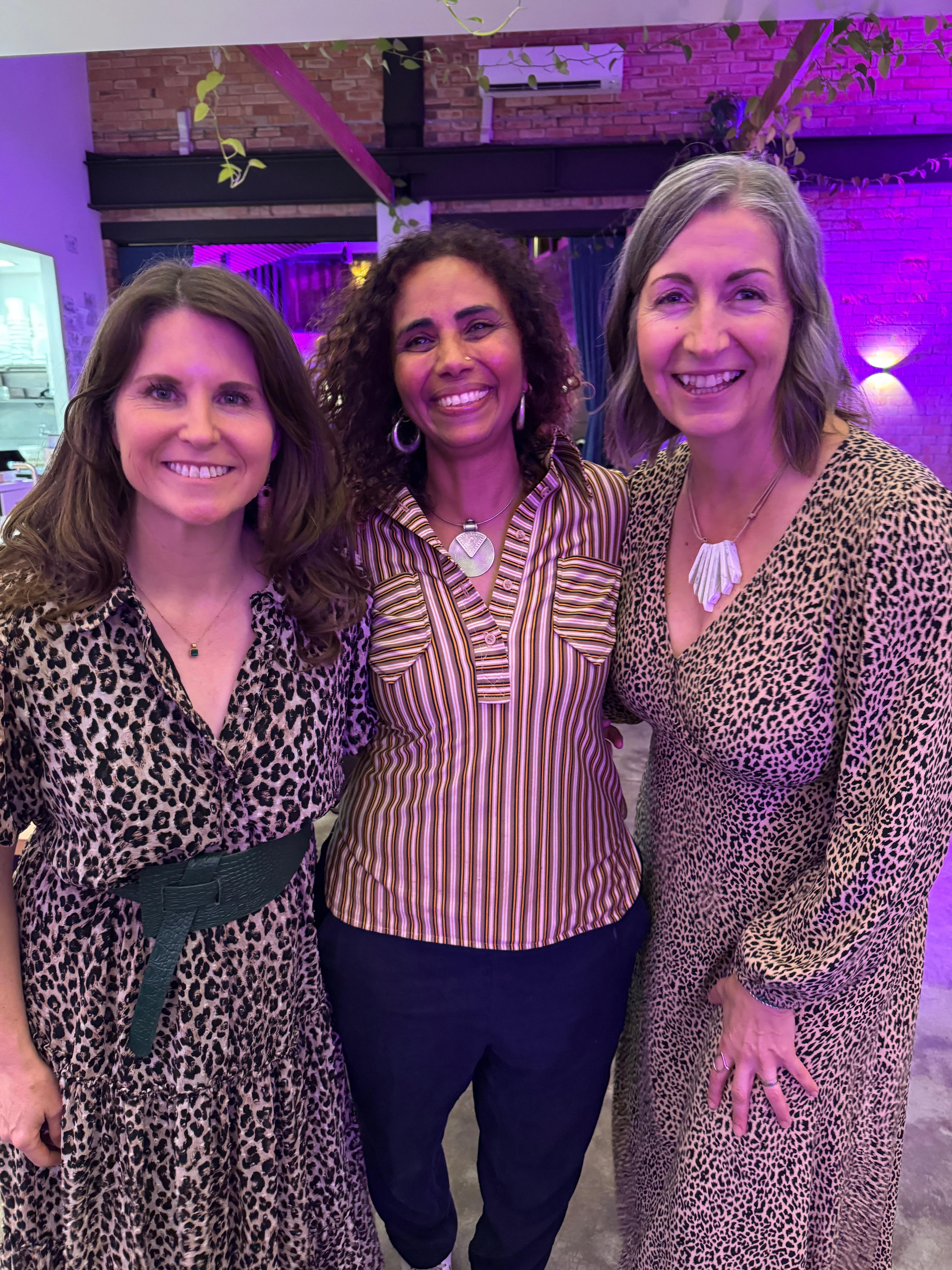 Kirsty Dunphey with two friends smiling together at an evening event